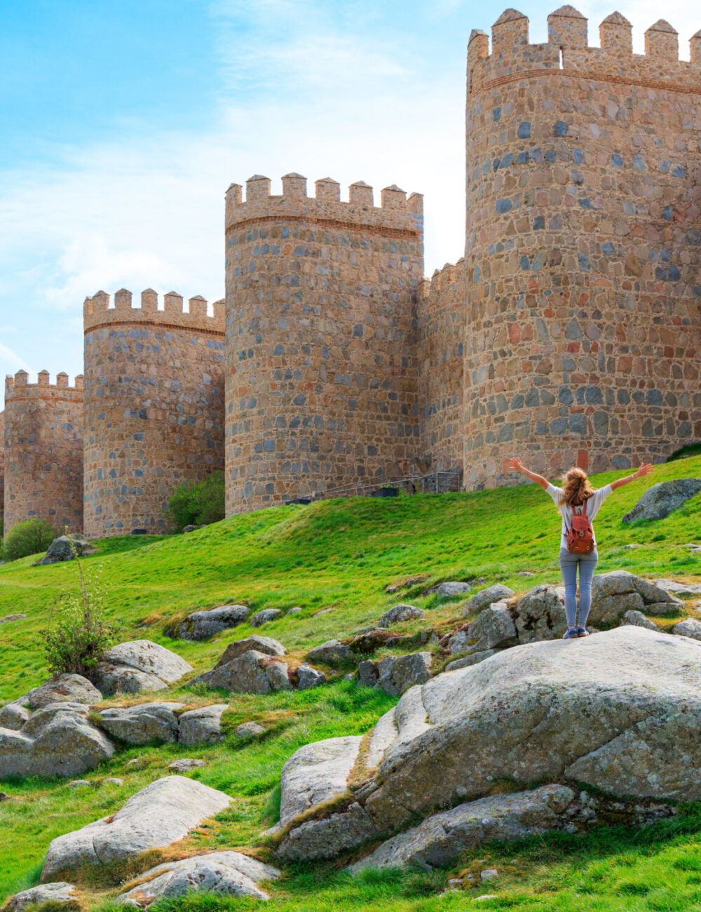 Woman tourist enjoying view of Avila surrounding wall in Spain- Castile and Leon